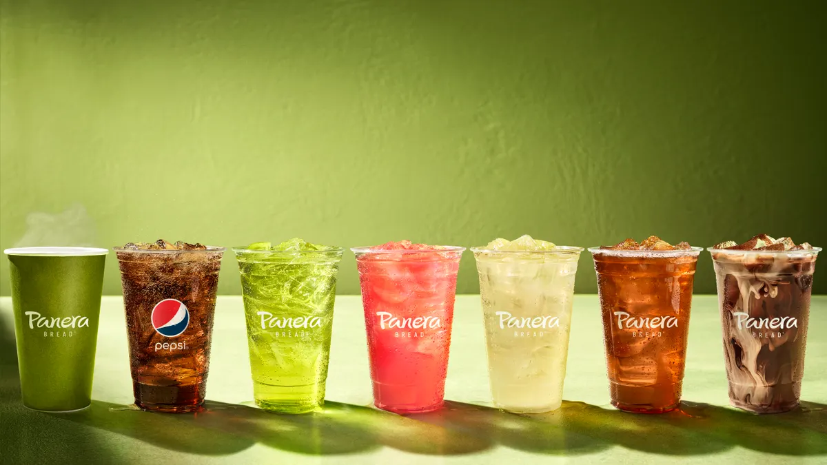 The image shows a row of drinks, including coffee and soda, available through Panera's Unlimited Sip Club