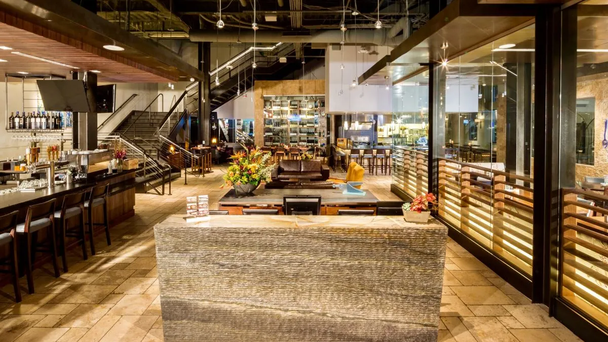 An image of a bar and seating area inside Pinstripes