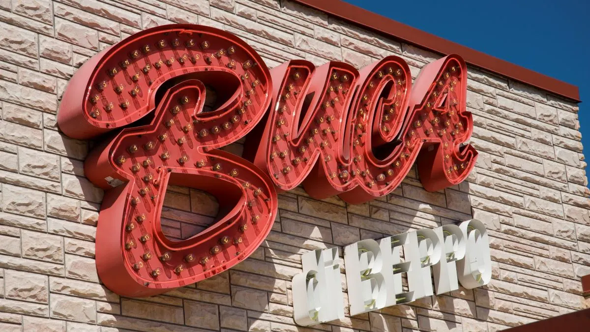An image of a beige brick building with a large sign that says "Buca di Beppo."