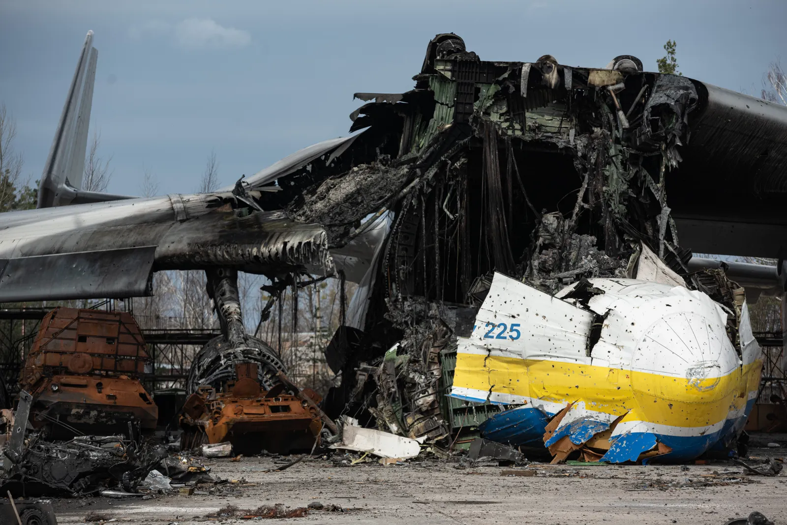 Wreckage at Hostomel airfield with destroyed Antonov aircraft in the forefront.